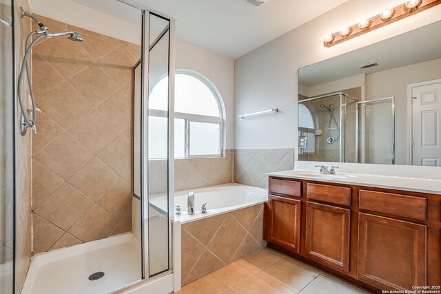 342 Perch Horizon, San Antonio, TX 78253 - bathroom with a bath, a stall shower, visible vents, tile patterned flooring, and vanity