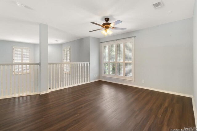 2527 Ashton Village, San Antonio, TX 78248 - spare room with wood finished floors, ceiling fan, baseboards, and plenty of natural light