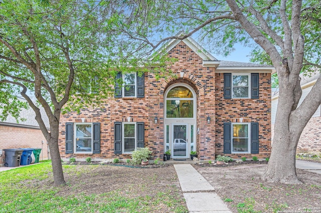 view of front of house featuring brick siding