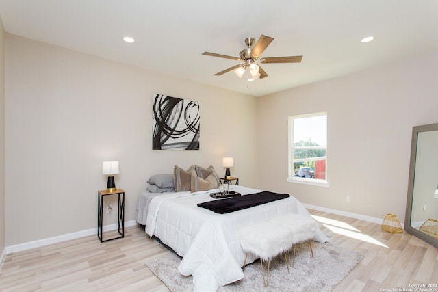 bedroom featuring light wood finished floors, baseboards, and recessed lighting