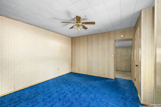 carpeted empty room with ceiling fan