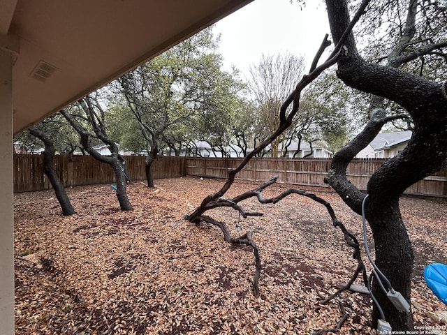 view of yard with a fenced backyard