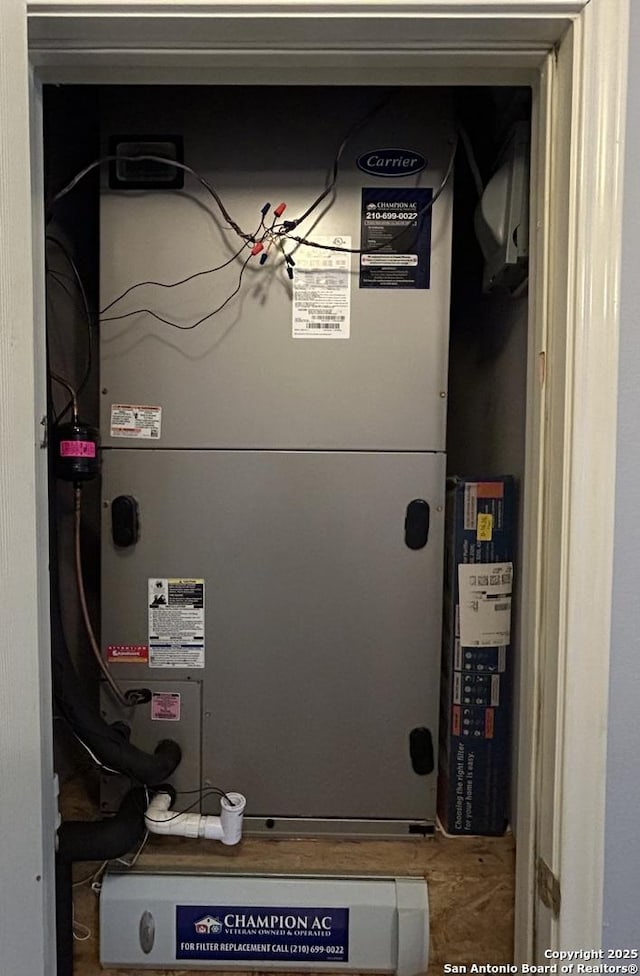 utility room with heating unit