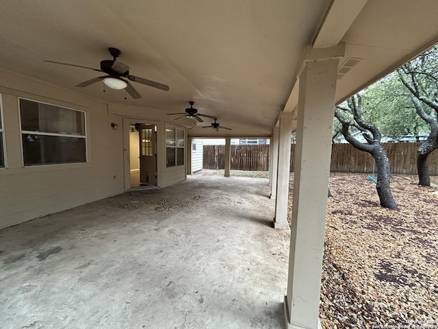 view of patio / terrace featuring ceiling fan and fence