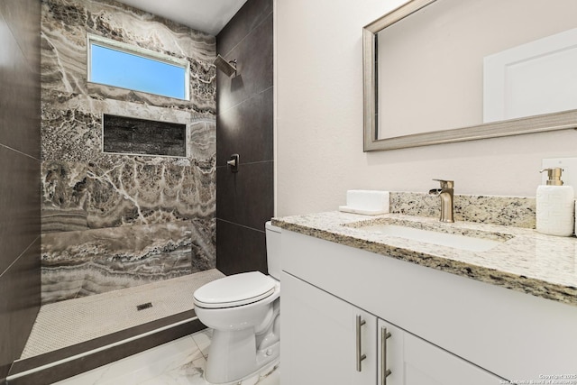 18262 Maureen Path, Lytle, TX 78052 - bathroom featuring marble finish floors, vanity, and tiled shower
