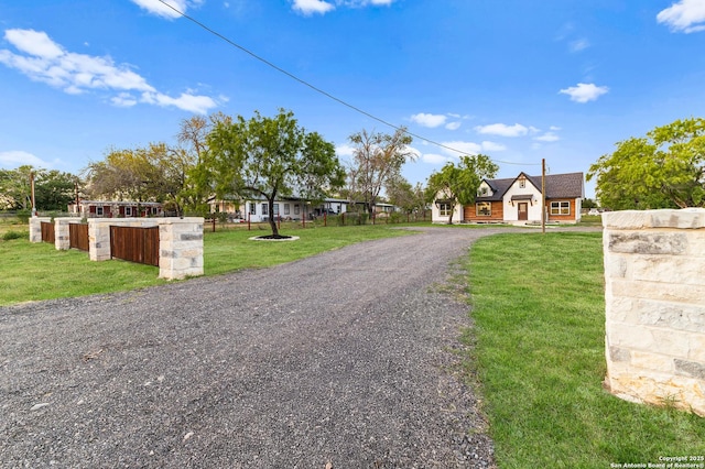 18262 Maureen Path, Lytle, TX 78052 - view of front facade with a front lawn and driveway