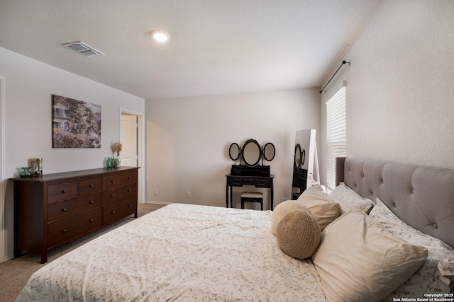 bedroom with carpet floors and visible vents