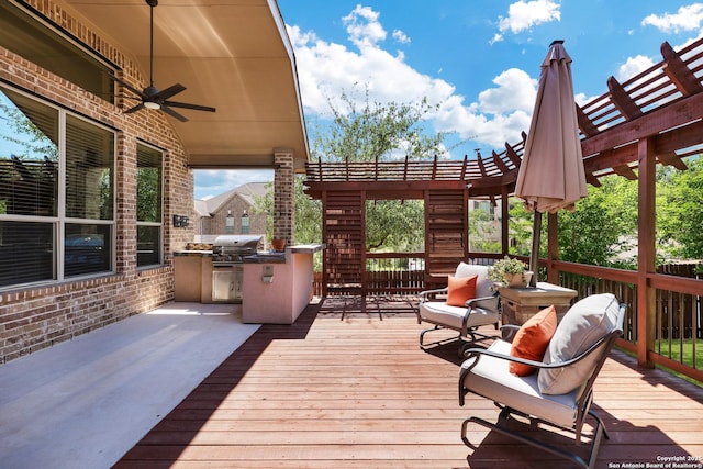 deck with area for grilling, a ceiling fan, and a pergola