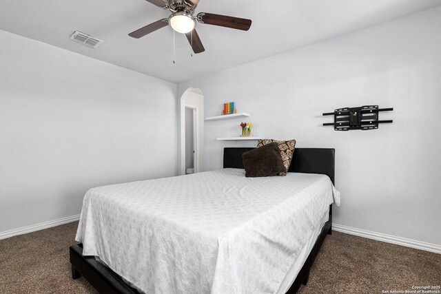 6772 Concho, Schertz, TX 78108 - carpeted bedroom with arched walkways, visible vents, baseboards, and ceiling fan