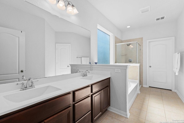 full bathroom featuring visible vents, tile patterned floors, a stall shower, and a sink