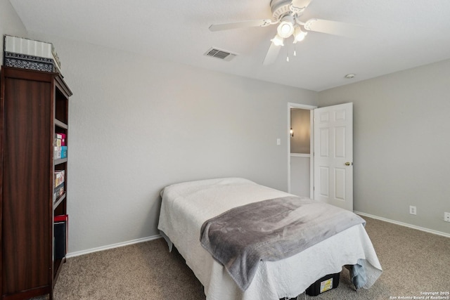 carpeted bedroom with baseboards, visible vents, and ceiling fan