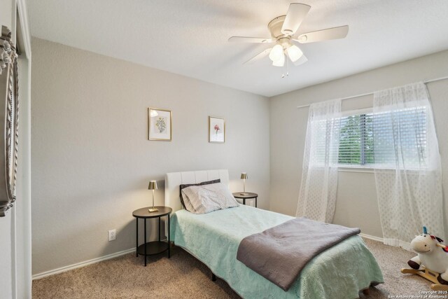 bedroom featuring carpet, baseboards, and ceiling fan