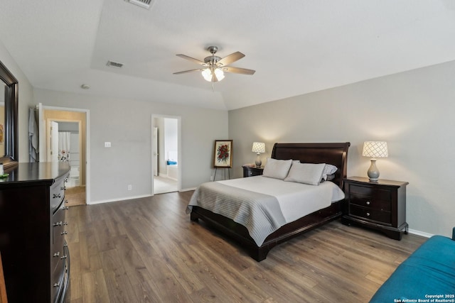 bedroom featuring visible vents, baseboards, wood finished floors, and ceiling fan