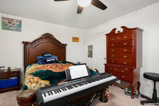 bedroom with a ceiling fan, carpet, and baseboards