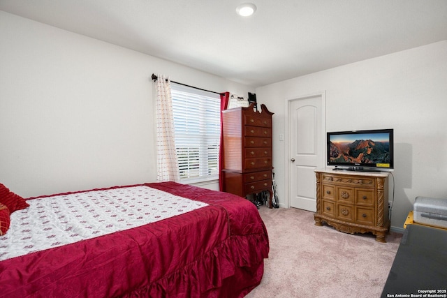 bedroom with light colored carpet