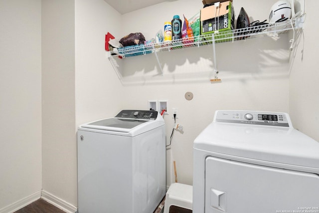 washroom featuring washing machine and clothes dryer and laundry area