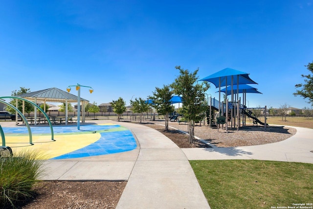 communal playground with fence and a gazebo