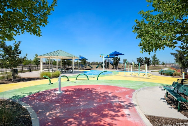 view of home's community featuring a gazebo, fence, and playground community