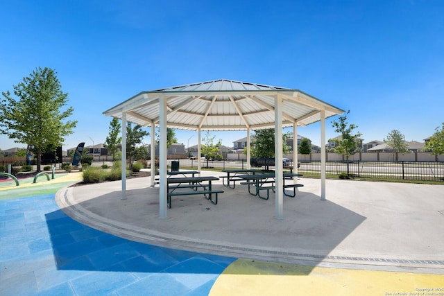view of community with fence and a gazebo