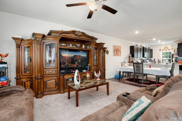 living area featuring recessed lighting, light carpet, and ceiling fan