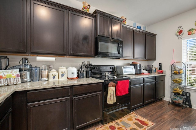 kitchen with light stone counters, dark brown cabinetry, black appliances, a toaster, and dark wood-type flooring