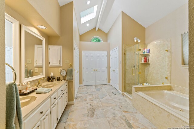 2307 Park Farm, San Antonio, TX 78259 - bathroom featuring a sink, lofted ceiling with skylight, double vanity, a stall shower, and a garden tub