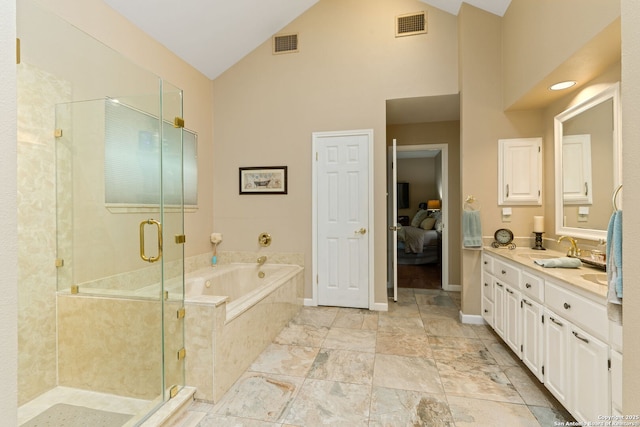 ensuite bathroom featuring a shower stall, double vanity, visible vents, a bath, and high vaulted ceiling