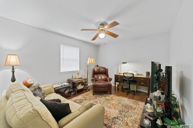 living room featuring a ceiling fan and wood finished floors