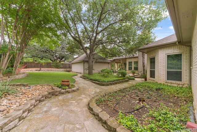 view of yard featuring a patio and fence