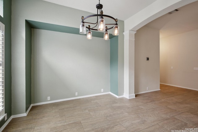 22010 Dolomite, San Antonio, TX 78259 - spare room featuring a notable chandelier, arched walkways, baseboards, ornate columns, and visible vents