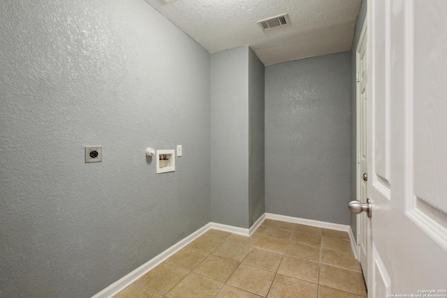 laundry room with washer hookup, laundry area, electric dryer hookup, visible vents, and a textured wall