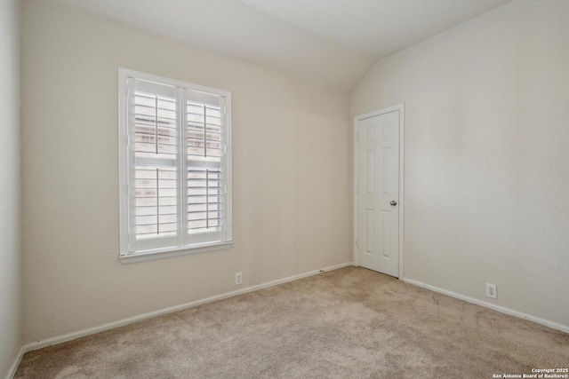 unfurnished room with carpet floors, baseboards, and a wealth of natural light