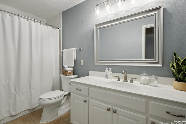 22010 Dolomite, San Antonio, TX 78259 - bathroom featuring a textured wall, tile patterned flooring, vanity, toilet, and curtained shower