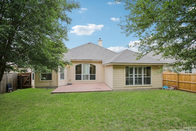 22010 Dolomite, San Antonio, TX 78259 - back of house with a fenced backyard, a yard, and a patio area