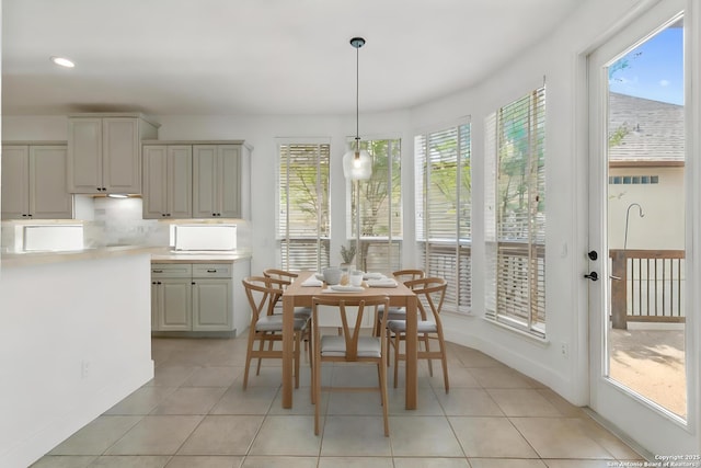 dining room featuring baseboards, recessed lighting, and light tile patterned flooring