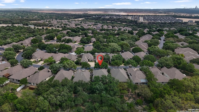 birds eye view of property with a residential view