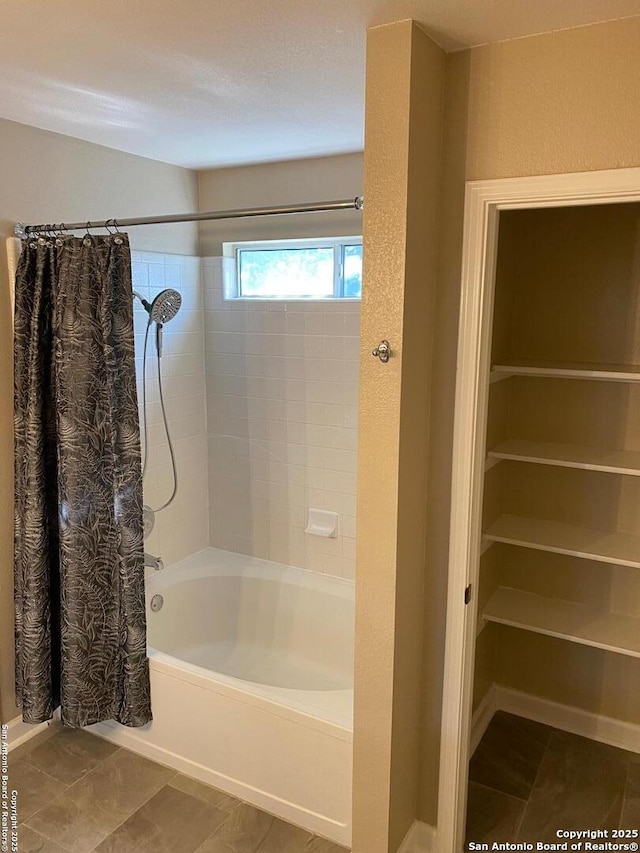 853 Satellite Vw, Round Rock, TX 78665 - bathroom with shower / bath combo with shower curtain and tile patterned flooring