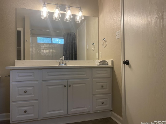 853 Satellite Vw, Round Rock, TX 78665 - bathroom featuring vanity, a shower with shower curtain, a textured wall, and baseboards