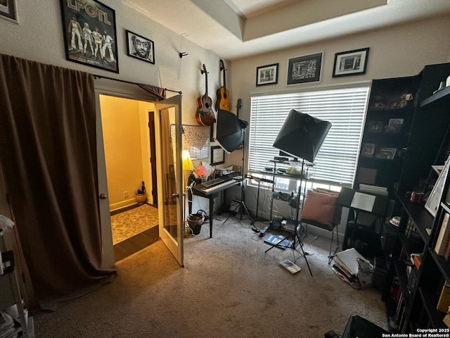 carpeted home office featuring french doors