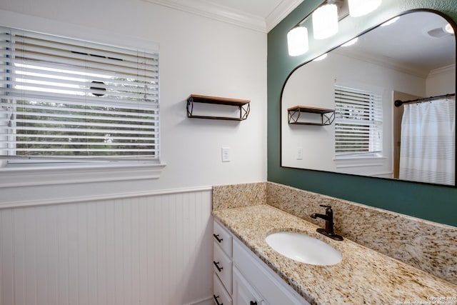bathroom featuring wainscoting, crown molding, vanity, and a shower with shower curtain