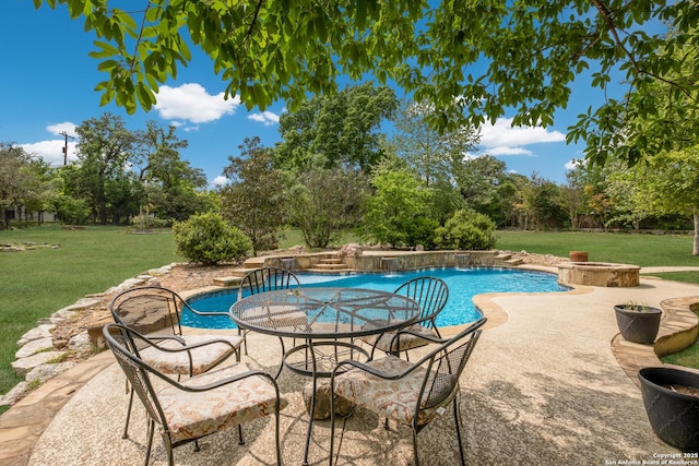 outdoor pool with a lawn, a fire pit, and a patio