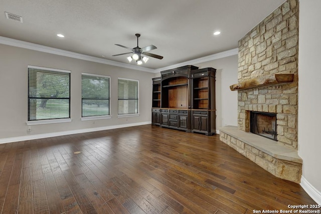 unfurnished living room with dark wood-type flooring, a fireplace, baseboards, and ceiling fan