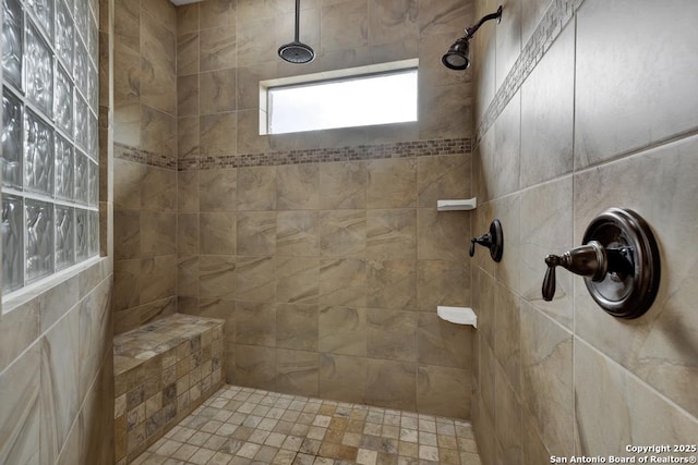 bathroom with a tile shower
