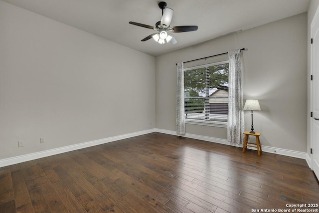 spare room featuring hardwood / wood-style flooring, baseboards, and ceiling fan