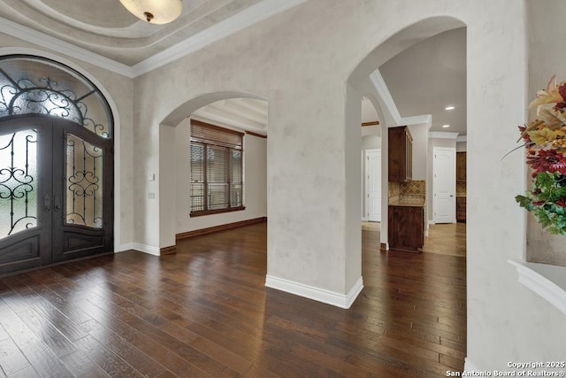 foyer with wood-type flooring, baseboards, and french doors