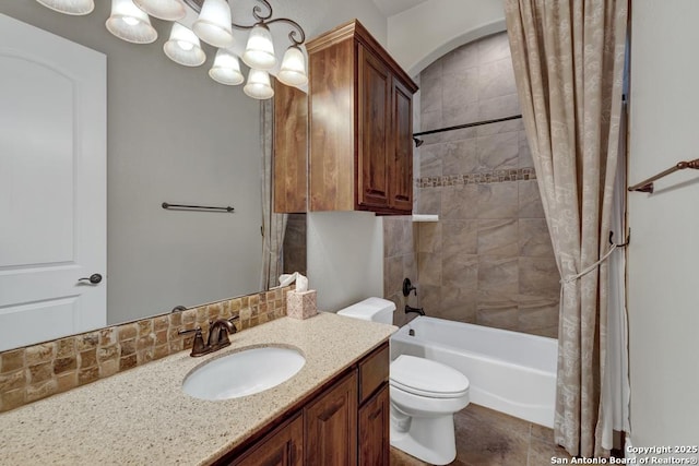 bathroom with an inviting chandelier, backsplash, toilet, vanity, and shower / tub combo