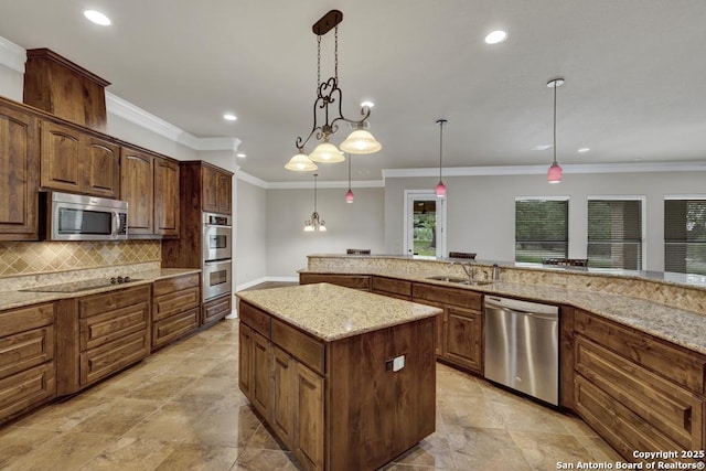 kitchen with recessed lighting, a kitchen island, decorative backsplash, hanging light fixtures, and appliances with stainless steel finishes