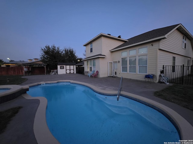 12031 Mill Love, San Antonio, TX 78254 - view of swimming pool featuring a fenced backyard, a storage unit, an outdoor structure, a gazebo, and a patio