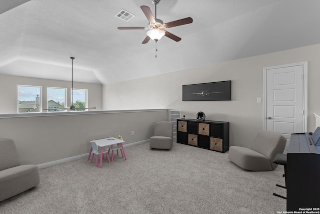 playroom featuring vaulted ceiling, ceiling fan, carpet floors, baseboards, and visible vents