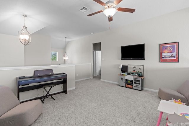 living area featuring visible vents, carpet flooring, baseboards, and ceiling fan